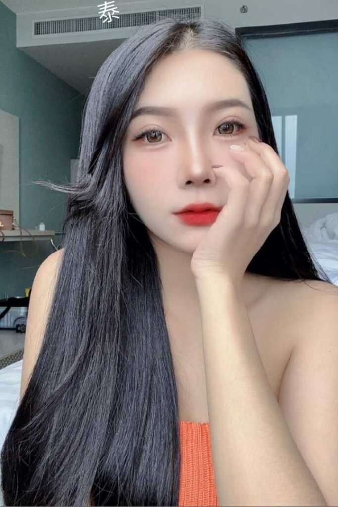 Portrait of a young woman with long black hair.