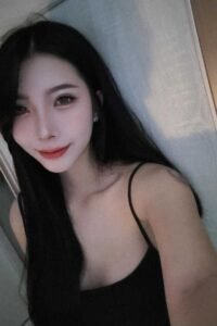 Portrait of a young woman with long black hair.