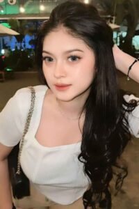 Attractive young woman with long dark hair.
