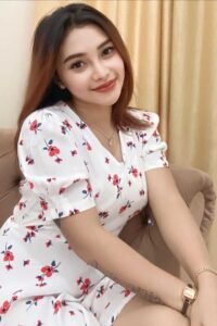 Attractive young woman in a floral dress.