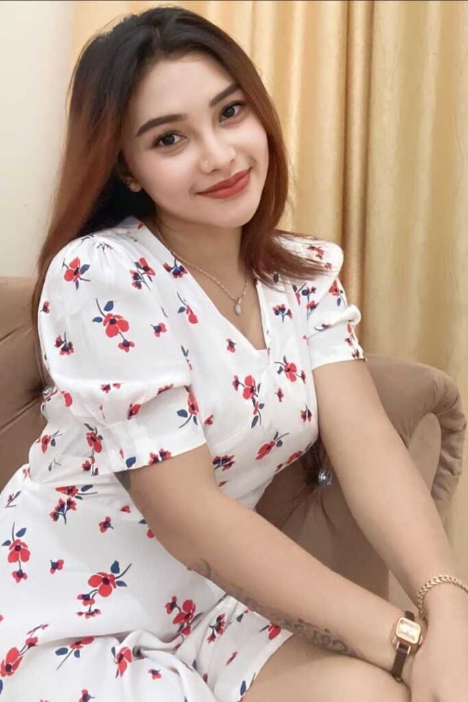 Attractive young woman in a floral dress.