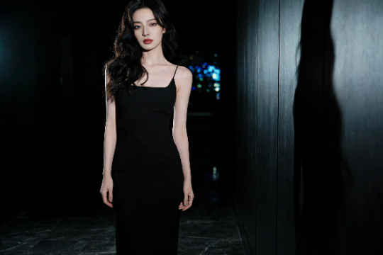 Elegant woman in a black dress, possibly related to KL escort services.