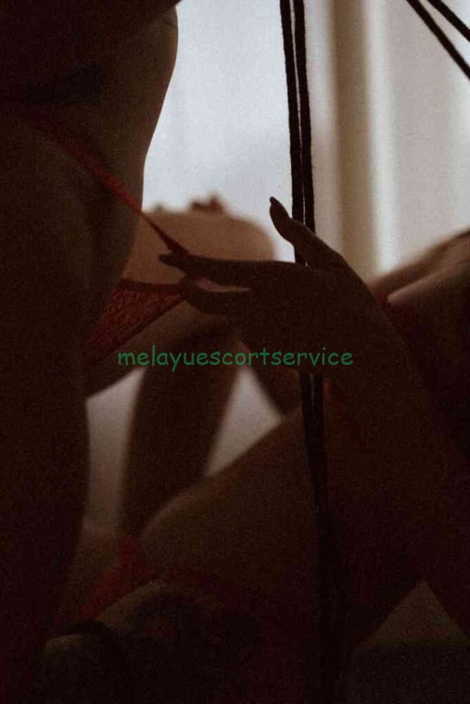 Silhouetted figures in intimate embrace, suggestive of a threesome.